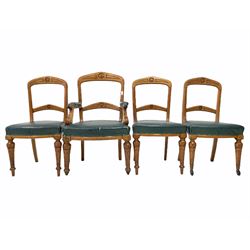 Set five (4+1) late Victorian oak dining chairs, rail back with floral roundel to centre, green vinyl upholstered seats, raised on carved turned and tapered front supports with castors, W57cm