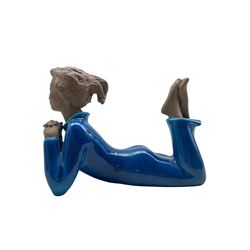 Royal Copenhagen part glazed stoneware figure of a laying woman no. 21952, designed by Johannes Hedegaard, L19cm