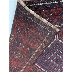 Persian hand knotted ground carpet, with pole medallion on red field, enclosed by multi line border, 240cm x 313cm