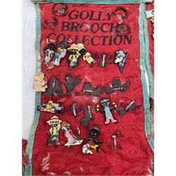 Golly Brooch Collection, a quantity of enamel brooches on red felt banners, some a/f
