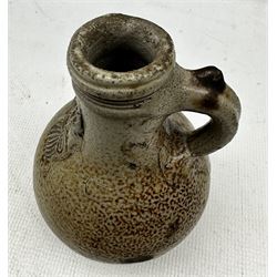 17th century Bellarmine or Bartmann salt glazed flagon, the neck applied with a mask of a bearded man H18cm. Provenance: discovered in 1953 during the redevelopment of the Portman Hotel, Portman Square, London