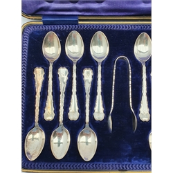 Set of twelve silver tea spoons and tongs, monogrammed and with decorative stems Sheffield 1905 Maker Lee and Wigfull, cased 6.7oz