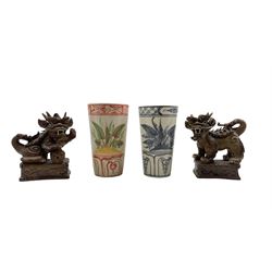 Pair of Chinese earthenware Dogs of Fo, together with two pottery beakers decorated with Dragonflies and foliage H11cm (4)