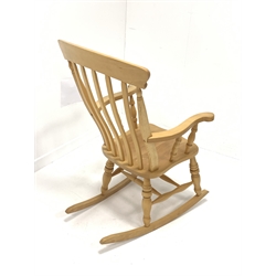 Beech Windsor style farmhouse rocking chair, with broad arms, dished seat, ring turned supports and double 'H' stretcher, W63cm