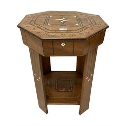 Early 20th century inlaid hardwood sewing table, octagonal form with hinged lid enclosing divisions, inlaid with geometric decorated and simulated ivory, on rectangular supports united by undertier 

This item has been registered for sale under Section 10 of the APHA Ivory Act