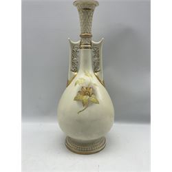 Victorian Royal Worcester Persian style vase, of pear form with twin floral pierced mounted handles and lattice slender neck, hand painted and gilded with floral sprays, upon a circular moulded foot, with puce printed marks beneath including shape number 942 and date code for 1886, H43cm