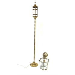 Early 20th century strapwork design brass lantern on barley twist brass column, H152cm together with a modern brass hall lantern (2)