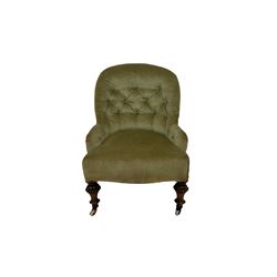 Victorian nursing chair, upholstered in buttoned back green fabric, raised on turned supports 