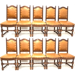 Ten Old Charm 18th century style oak high back dining chairs, leather stud upholstering over bobbin turned supports and stretcher, (W51cm)