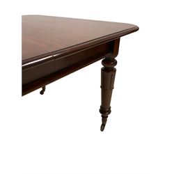 Victorian mahogany pull-out action extending dining table, the extendable top with one additional leaf, raised on turned supports, terminating in ceramic castors 