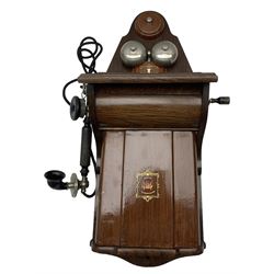 Early 20th century Danish wall mounted 'Jydsk Telefon Aktieselskab', oak and scumbled metal case with original cable and hand crank, with painted emblem