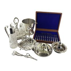 Silver plated shell shape dish by John Round with cherub handle W20cm, plated oval six bottle cruet, glass claret jug with plated cover , ice bucket and other plated items
