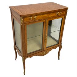 Early 20th century Kingwood parquetry display cabinet, rectangular top with rounded front corners inlaid with a panel of cube work within bands, fitted with single drawer over two glazed doors, the interior with glass shelf, shaped apron and cabriole supports with ornate gilt metal mounts