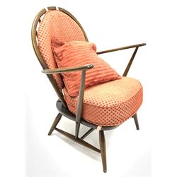 Ercol dark elm spindle and hoop back armchair, with upholstered squab cushions, raised on turned supports joined by 'H' stretcher, (W72cm)
