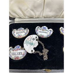 Cased set of six Crown Staffordshire porcelain decanter labels, retailed by T. Goode & Co. 