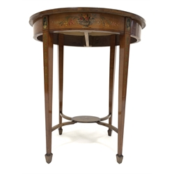 Edwardian satinwood Sheraton revival occasional table, oval top decorated with central oval plate depicting cherubs surrounded by floral garlands, the band decorated with interlacing ribbon and trailing foliage, square tapering supports with spade feet connected by undertier and curved stretchers, 63cm x 43cm, H72cm