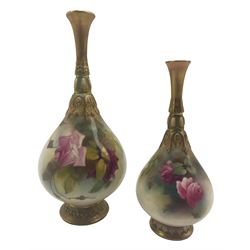 Two early 20th century Royal Worcester vases, of bottle form with relief moulded slender necks, each hand painted with roses, with green and puce printed marks beneath including shape number 153, and one with date code for 1907, H21cm max (2)