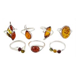 Seven silver amber stone set rings, all stamped or tested