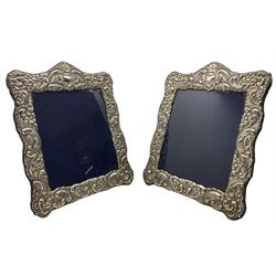 Pair of silver photograph frames with floral embossed decoration aperture size 25cm x 20cm Sheffield 2004 Maker Carr & Co