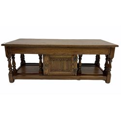 Old charm - oak nest of three tables, cupboard to centre with linen fold carving, raised on turned block supports 123cm x 51cm, H48cm