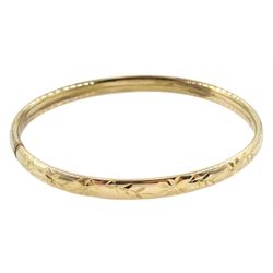 Gold bangle with bright cut decoration, Birmingham import marks 1990, approx 5.75gm