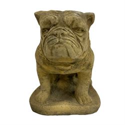 Pair of composite stone garden ornaments in the form of seated British Bulldogs