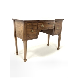 George IV mahogany break bow front sideboard, with ebonised string inlay, two drawers and a cupboard, raised on square tapered supports with spade feet