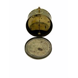 Mid-19th century French circular brass cased portable timepiece on three turned feet with circular carrying ring, removable rear cover with original instructions, dial bezel with bevelled flat glass, circular card dial with Roman numerals and minute track, steel moon hands, eight-day spring driven drum movement with a deadbeat “tick-tack” escapement and integral adjustable pendulum, wound and set from rear, movement backplate stamped “VAP Brevet SGDG”.  
Victor Athanase Pierret was born in Bucy-les-Pierrepont, France, in 1806 and died in 1893, working in Paris he was a prolific maker and exporter of clock movements mostly stamped with his initials VAP, exhibiting at the London Great Exposition of 1851 where he presented a 