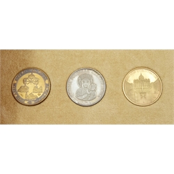 Bronze, silver & gold John Paul II Vatican three coin/medallion commemorative set, housed in a small case, with original receipt, the gold medallion stamped '750' weighing 8 grams, the silver medallion stamped '925' weighing 8 grams and the bronze medallion weighing 9.9 grams
