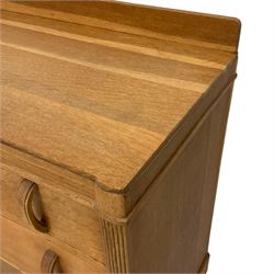 Early 20th century oak chest, fitted with three graduating drawers flanked by reeded uprights
