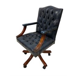Gainsborough design swivel desk chair, upholstered in deep blue finished buttoned leather with studwork, the adjustable and reclining seat raised on five splayed supports with castors 