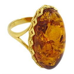 Silver-gilt oval Baltic amber ring, with pierced gallery and shoulders, stamped 925