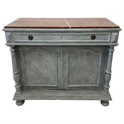 Late 19th century painted walnut side cabinet, rectangular variegated rouge marble top over single long drawer and double cupboard, the cupboard enclosed by two panelled doors carved with foliate scrolls and trailing foliage, two turned upright pilasters, moulded platform base on turned feet, in waxed pale blue paint finish 