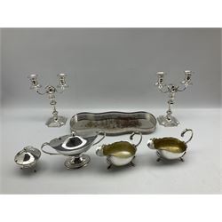 Pair of late Victorian Elkington & Co silver-plated candelabra, each with two branches on shaped bases H28cm, pair of silver-plated sauce boats, pair of pierced bottle coasters, Georgian style navette shaped sauce tureen, galleried tray etc (8)
