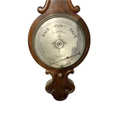 Robinson of Bradford -  late19th-century mercury wheel barometer in a mahogany case, with a scroll carved top and conforming base, 12-inch silvered register reading barometric air pressure in inches, steel indicating hand and brass recording hand with recording button. 
Daniel Robinson is recorded as working in Bradford as a barometer maker c.1870