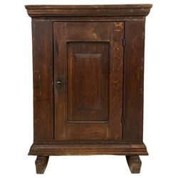 18th century design oak plank cupboard, moulded cornice over single panelled door, fitted with two internal shelves, moulded lower skirt over on sledge supports