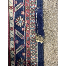 Large Persian design blue ground carpet, with lozenge medallion on blue field enclosed by stylised geometric decoration and multi line border, 550cm x 375cm