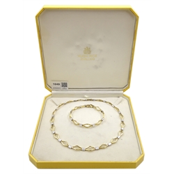 9ct yellow and white gold necklace and matching bracelet, both stamped 375, retailed by Hugh Rice in original box