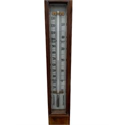 Late 19th century walnut boxwood cistern stick barometer with a double canted register and weather predictions, measuring barometric air pressure from 27 to 31 inches, arched glazed top and rectangular trunk, with twin vernier setting discs above a mercury Fahrenheit and Celsius scale thermometer, the rounded base with a circular moulded cistern cover.