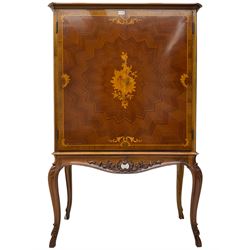 Italian marquetry inlaid walnut drinks cabinet, the doors with central satinwood floral cartouche inlay and extending star pattern parquetry, the maple interior with mirror back and central shelf over small drawers and pigeonholes, fitted with sliding tray and two long drawers, the carved and moulded apron with pierced C-scroll decoration and extending foliage, raised on cabriole supports