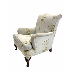 Late 19th / Early 20th century armchair upholstered in floral fabric, with feather filled squab cushion, raised on cabriole front supports W75cm, height to seat 47cm