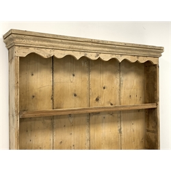 Victorian pine dresser, two heights plate rack above double panelled cupboard, plinth base, W109cm, H198cm, D42cm