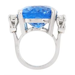 Platinum oval blue topaz ring, with four round brilliant cut diamonds set either side, hallmarked, topaz approx 30.00 carat, total diamond weight approx 2.50 carat
