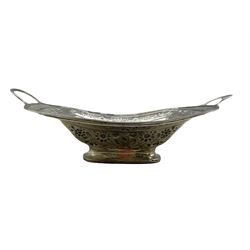George III silver rectangular two handled fruit dish embossed with flower heads and leaves and with an engraved crest on a pedestal foot L36cm overall London 1807 15.7oz