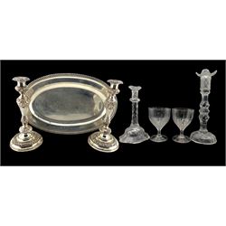 Pair of Sheffield plate candlesticks with acanthus moulded stems and circular bases, H31cm, 19th century silver-plated serving tray with gadroon edge, two 19th century glass candlesticks with faceted stems and a pair of 19th century glass goblets 