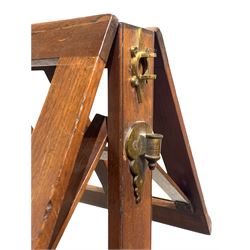 Victorian mahogany rise and fall duet music stand, fitted with a later brass sconce, raised on turned column and three inverted scrolled splayed supports 