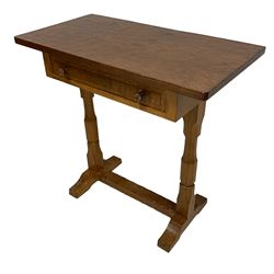 Beaverman - oak side table, rectangular adzed top, fitted with single drawer with Yorkshire rose carved handles, raised on octagonal turned supports with sledge feet, united by adzed stretcher, carved with beaver signature to foot, by Colin Almack, Sutton-under-Whitestonecliffe