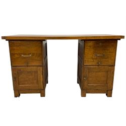 Hanningtons - mid-20th century oak twin pedestal desk, rectangular two-plank top, fitted with two filing cabinet drawers over two panelled cupboards, on square feet