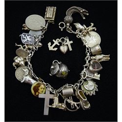 Edwardian silver agate shamrock cooking pot charm by John Grinsell & Sons, Birmingham 1901 and a silver bracelet with Victorian and later silver charms including hardstone heart by William Goss, dachshund, poodle, teapot, swan and scarecrow