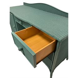 Lloyd Loom of Spalding - wicker dressing table or sideboard painted in teal, shaped raised back over rectangular top, fitted with single frieze drawer and three short drawers with one cupboard, on splayed feet